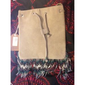 Star Mela fringe drawstring shoulder bag